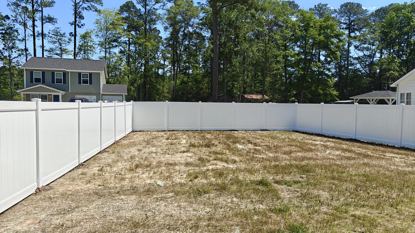 White vinyl privacy fence installation